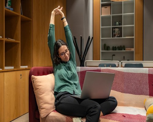 Person doing gentle stretching at the home office